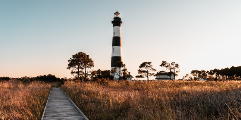 Bodie Island Lighthouse Sunset Image of sunset behind Bodie Island Lighthouse in Nags Head.