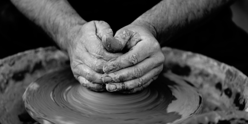 Local Handmade OBX Art Local Handmade OBX Art - Image of hands working on pottery wheel, black and white