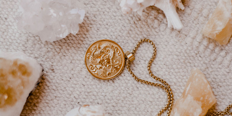 Handmade Outer Banks Jewelry Handmade Outer Banks Jewelry - Necklace with shells and crystals on a tan blanket.