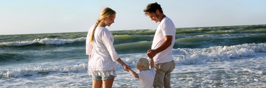 outer banks family in the surf